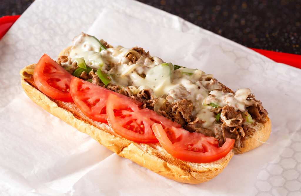 Open faced Philly steak and cheese sandwich